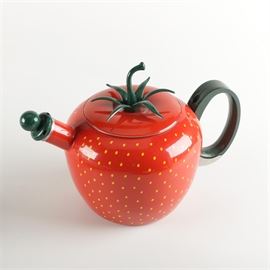 Copco "Strawberry" Enamel on Steel Tea Kettle: A “Strawberry” tea kettle by Copco. This piece is composed of steel with a red enameled finish, as well as a yellow seed dot design around the body, a green harmonic whistle, side handle, and stem and leaf shaped finial on the lid. The underside of the lid is marked, “Copco 1203”.