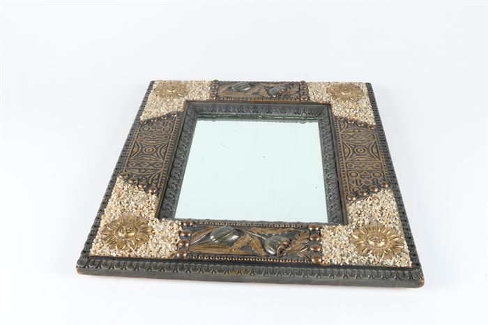 Antique Tramp Art Wall Mirror: A antique steampunk wall mirror. The mirror is rectangular in shape and features a wooden frame in a dark and light finish. The frame is decorated with gold tone sunburst accents, an embossed pattern along the edges, and a stone textured finish. The back of the mirror offers a wire attachment.