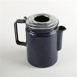 Vintage Enamelware Coffee Pot: A vintage enamelware coffee pot. This item is constructed of metal and features an enamelware exterior with a dark blue and white speckled pattern detail. The coffee pot has a hinged silver tone top lid and a side handle. There are no makers marks.