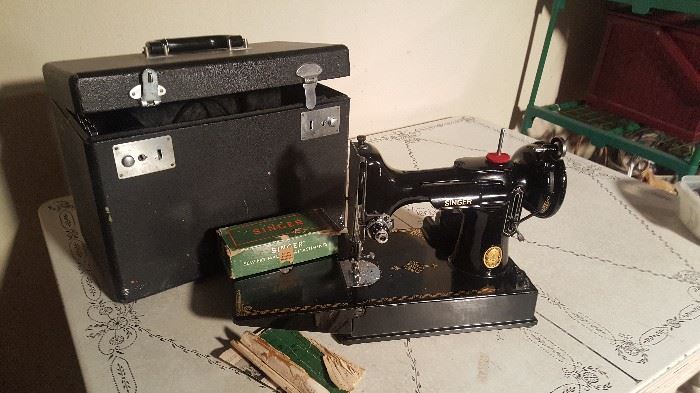 Excellent condition!
Singer Featherweight Sewing Machine with case and attachments
Model 3-120 Serial #AL-412645
