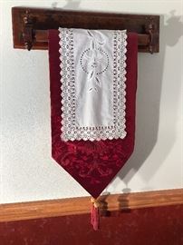 One of a kind table runner on a quaker-style wooden hanger