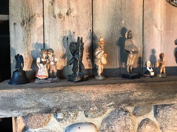 Large selection of carved figurines, hummels, artwork