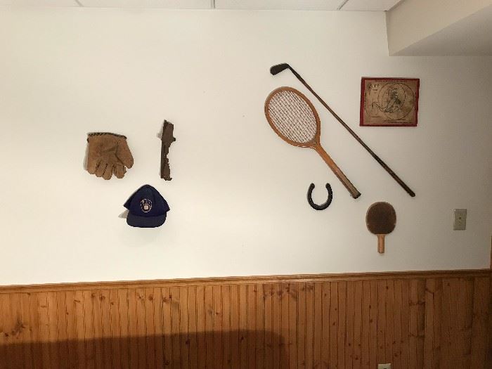 Antique sporting items displayed on wall
