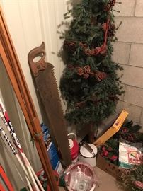 Antique saw, cross country skis, Christmas items
