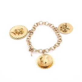 14K Yellow Gold Charm Bracelet With Circle Charms and Colored Glass Accents: A 14K yellow gold charm bracelet with circle charms and colored glass accents. This charm bracelet features three circle charms. Two of the charms have raised script “I Love You” and “Today Tomorrow and Forever”. All the charms have colored glass bead accents.