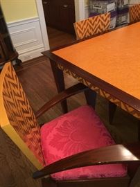 Hand crafted dining table with inlaid geometric design 