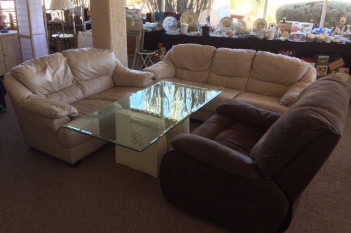 Leather Sofa and love seat. Plaster, wood and glass coffee table.