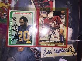 Johnny Rodgers and Mike Rozier signed cards