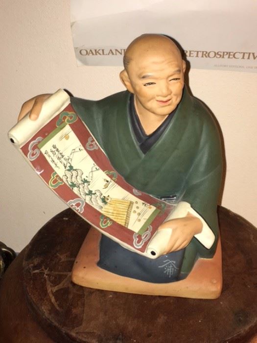 Japanese figure with scroll