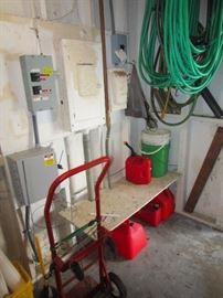 Gas cans, hoses, coolers and a dolly