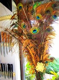 Amazing bouquet of peacock feathers in a large crystal vase