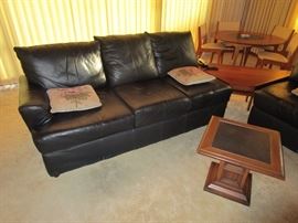 A Matching Pair of  Black Leather Sectionals--immaculate!  (Left sectional)  Italian slate rock topped  coffee table x 3 ea in fore ground.