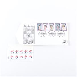 United States and British Postage Stamps: A group of United States and British postage stamps. This collection of postage stamps features a first day cover of the five stamps issued by the Royal Mail to commemorate the life of Princess Diana issued at the Great Brington post office in the village on the grounds of Althorp House on February 3, 1998. Also included is a sheet of ten United States three cent star stamps.