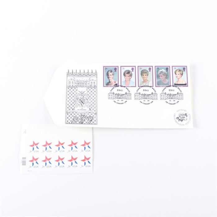 United States and British Postage Stamps: A group of United States and British postage stamps. This collection of postage stamps features a first day cover of the five stamps issued by the Royal Mail to commemorate the life of Princess Diana issued at the Great Brington post office in the village on the grounds of Althorp House on February 3, 1998. Also included is a sheet of ten United States three cent star stamps.