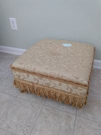 Gold ottoman you could use anywhere!
