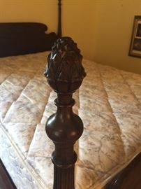 Detail of pineapple bed post finials on full size bed - Regis Four Seasons mattress set