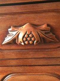 Detail of handles/pulls on cherry wood bedroom pieces