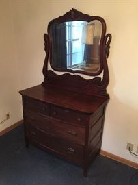 Serpentine Dresser with Mirror that has Swans on opposing sides