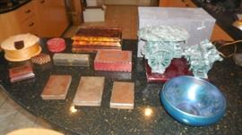 Kitchen-SMALLS Area:  Several fun boxes are to the left above three copper [Latin] book plates.  On the right is a 4-horse carriage made of "Chung Yang Jade" along with its original box; and in the lower right is an unsigned bowl.