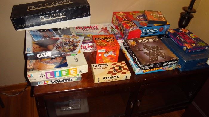 Assorted vintage games on TV stand also for sale. 