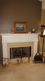 Oil painting and gorgeous cut glass candlesticks on fireplace.   Other assorted pieces.  