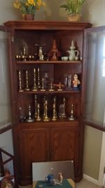 Vintage gorgeous cabinet full of candlesticks and collectibles.   