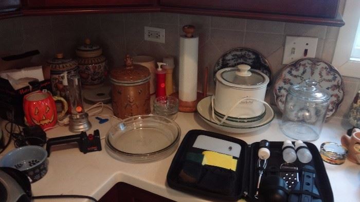 Miscellaneous kitchen items, crock pot, canisters, pie pans, etc.