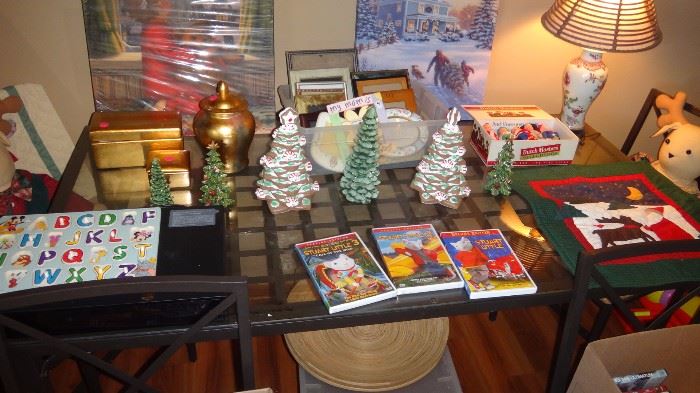 Lovely glass top modern table with 4 chairs, assorted Christmas items,  dvd player,  lots of dvds.  