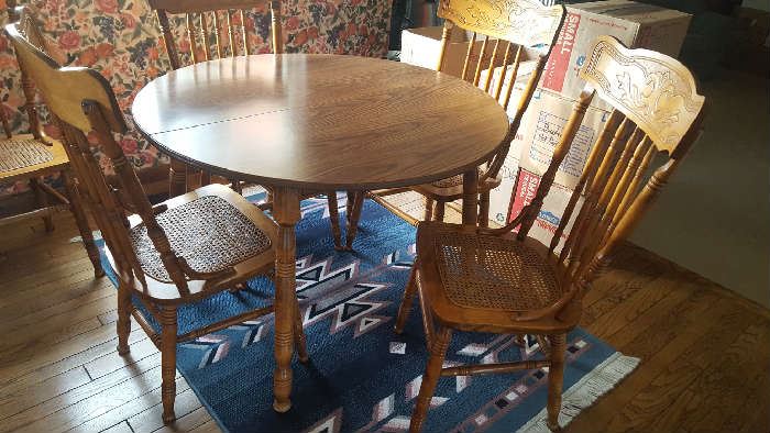 $225  Round, formica top kitchen table and chairs