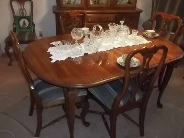 excellent condition dining table, two captains chairs, 4 side chairs, two leaves and matching china cabinet