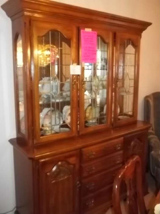 excellent condition lighted china cabinet with antiqued glass