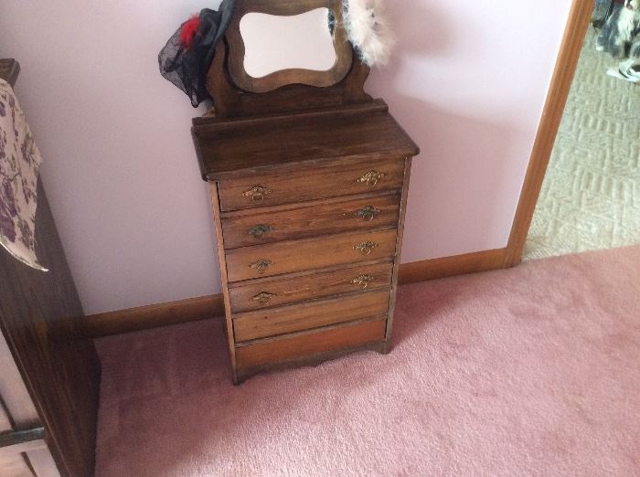 Antique child’s dresser or possibly a salesman sample. It is larger than a toy