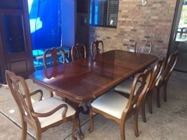 Dining room set with 8 matching chairs and 2 leaves