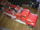 This Toy Tonka firetruck has original hoses AND a fire hydrant to boot!