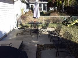 Party on the Patio - Long lasting wrought iron! Two wrought iron tables with 4 spring action chairs and umbrella, two wrought iron glider loveseats, two side wrought iron chairs with two small round wrought iron end tables and wrought iron tea cart