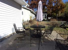 Party on the Patio - Long lasting wrought iron! Two wrought iron tables with 4 spring action chairs and umbrella, two wrought iron glider loveseats, two side wrought iron chairs with two small round wrought iron end tables and wrought iron tea cart
