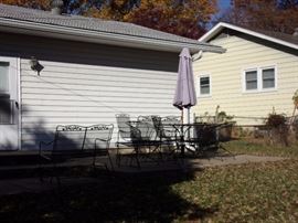 Party on the Patio - Long lasting wrought iron! Two wrought iron tables with 4 spring action chairs and umbrella, two wrought iron glider loveseats, two side wrought iron chairs with two small round wrought iron end tables and wrought iron tea cart