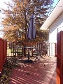 Party on the Patio - Long lasting wrought iron! Two wrought iron tables with 4 spring action chairs and umbrella, two wrought iron glider loveseats, two side wrought iron chairs with two small round wrought iron end tables and wrought iron tea cart