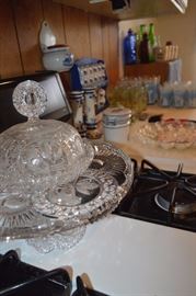 Glass pie stand, blue seasoning jars