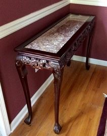 Carved side table with marble top