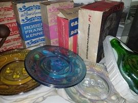 Historical books and multicolored dessert plates