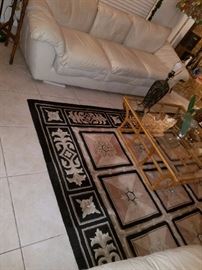 White leather sofa, gold and glass coffee table,  rug and more