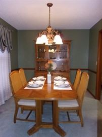 Dining room table with 6 wicker back chairs(2 captain not pictured and china cabinet
