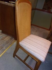 Dining room table with 6 wicker back chairs(2 captain not pictured and china cabinet