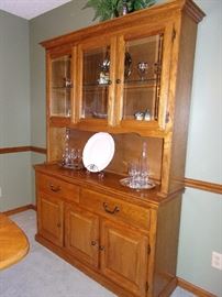 Dining room table with 6 wicker back chairs(2 captain not pictured and china cabinet