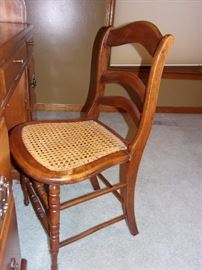 Oak roll top desk and cane seated chair