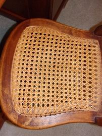 Oak roll top desk and cane seated chair
