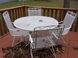 White wrought iron patio table and 4 chairs