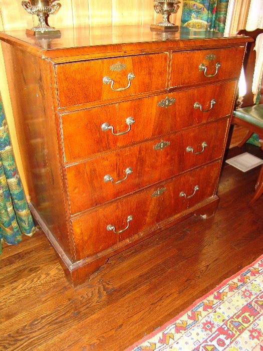Antique English chest  Circa 1850  from the Robert Crump collection which has 3 large drawers and 2 upper drawers and brass bail pulls and key escutcheons and bracket feet.  