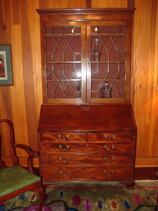 Exquisite mahogany secretary from the Beacon Hill collection.   This secretary has a fall front, 2 small drawers and 3 large drawers on the base and partitioned glass doors with 3 shelves, OJ feet